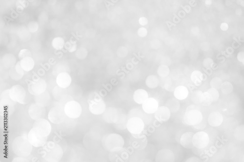 Obraz na plátně Light reflections create bright spots on a white background