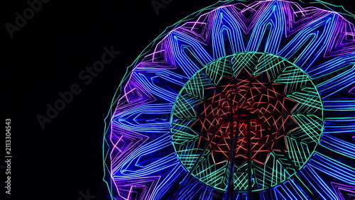 Vibrant Neon Geometric Lights On Amusement Ride