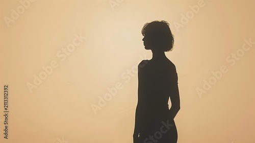 Minimalist portrait composition showing a short-haired woman silhouette looking sideways against warm beige backdrop.
