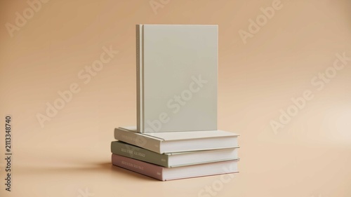 Minimalist blank hardbound book cover mockup resting elegantly atop a small stacked pile of pastel colored books on beige background