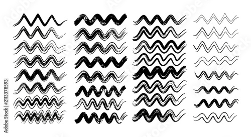 Фотография Variety of hand-drawn wavy lines, zig-zag brush strokes, and grunge texture elem