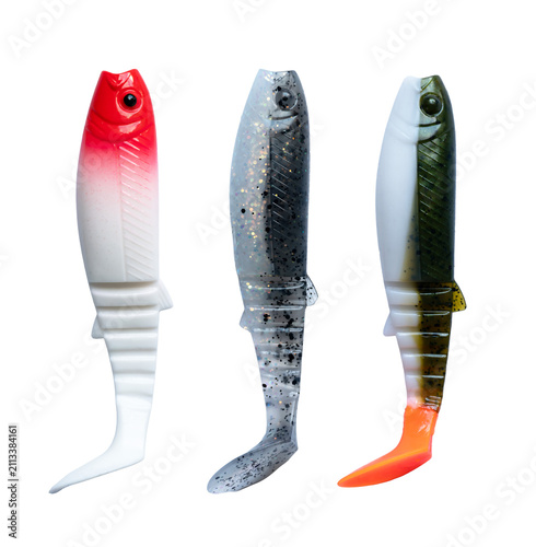 Foto Fishing lure soft silicon bait assortment, set of three swimbaits in red head, dark glitter, and orange tail finishes for predator spinning