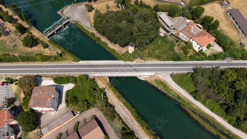Картината върху платно Overhead View of Canal and Bridge: An aerial perspective showcases a modern brid