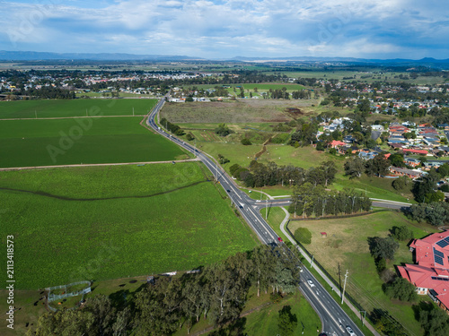 Floodplain farmland with road in Singleton seem from drone view