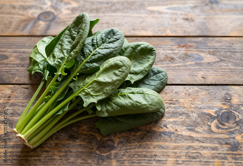 Fresh spinach bunch on rust...