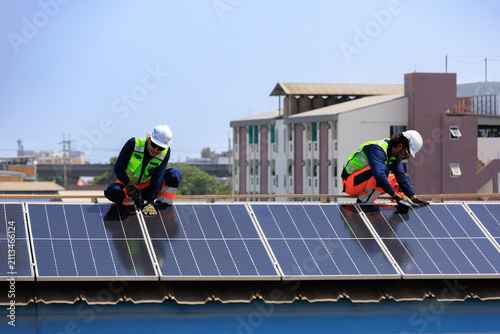 solar energy renewable sustainability.Engineers installing rooftop solar panels to support renewable energy, Net Zero and ESG goals with clean power, energy efficiency and sustainable infrastructure.