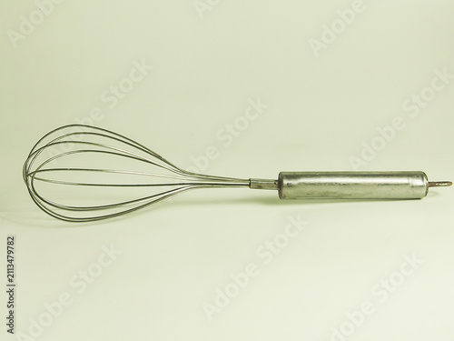 Classic stainless steel wire balloon hand egg whisk isolated on white background