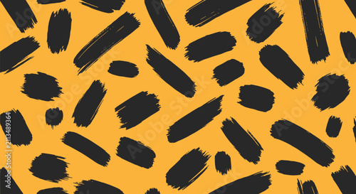 Animal print inspired seamless pattern with bold black brush strokes on vibrant mustard yellow background.