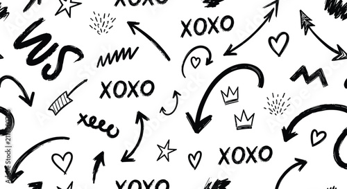 Playful seamless pattern with hand drawn doodle elements like arrows hearts crowns stars and text on white background.