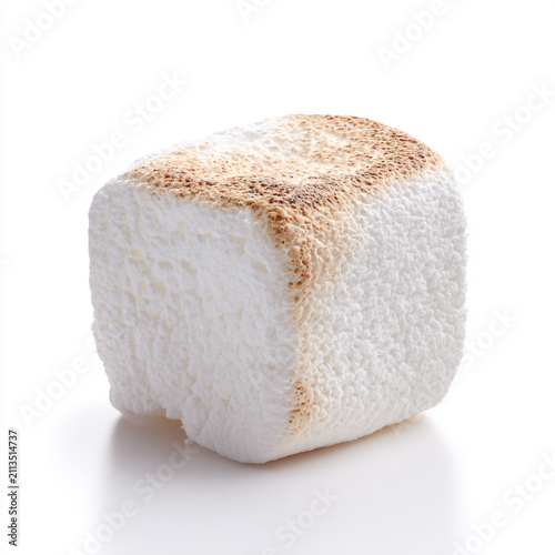Soft fluffy white marshmallow piece isolated on a clean white background. Clean studio photography highlighting smooth sugary texture and delicate shape.