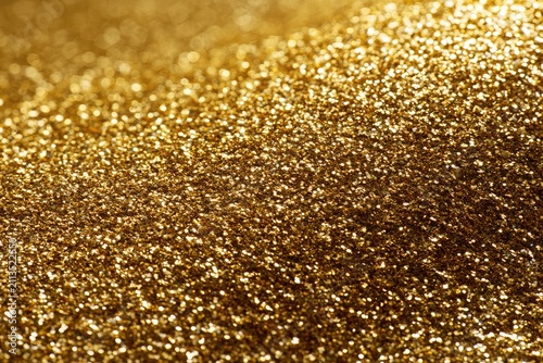 A close-up abstract shot of shimmering, golden glitter, softly lit