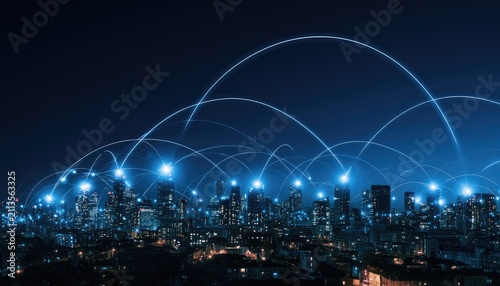 Illuminated cityscape with glowing digital connections spanning across the urban night