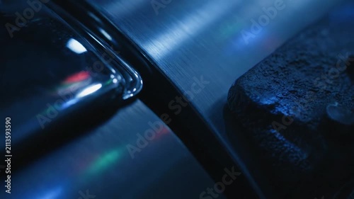 Abstract Blue Disco Light Reflections on Metal Surface