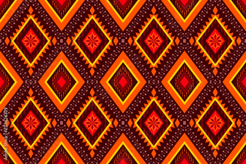 Ethnic ikat diamond seamless pattern. Orange tribal geometric embroidery vector background for boho fashion textile, fabric print, wallpaper, home decor and wrapping paper design.