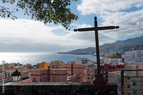 Iron cross overlooking coastal town, Santa Cruz de La Palma, Canary Islands