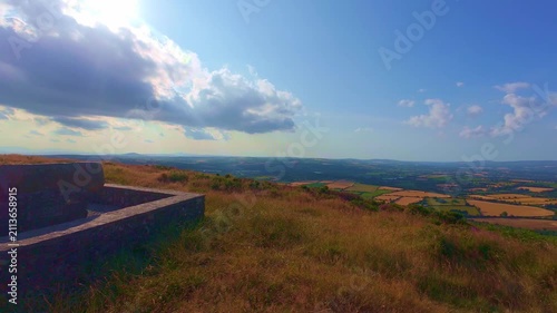 Slow motion stone monument triangulation pillar on hill peak