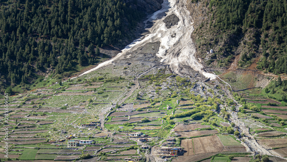 Naklejka premium Avalanche and landslide debris flow path descending into Zanskar valley terraced village fields in Ladakh