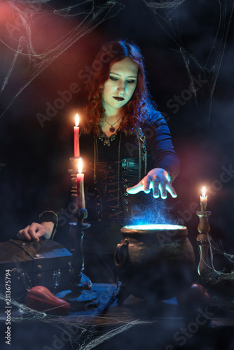 Quadro su tela Witch casts spell, cauldron, boiling magic potion, candles, skull