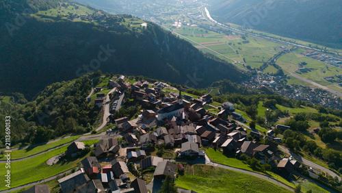 Konstfotografi Aerial drone landscape of Ergisch alpine village in Switzerland, featuring the i