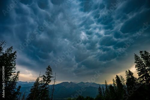 Dramatic Mammatus Clouds Above Mountain Forest Before Storm
