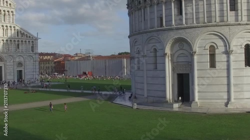 High altitude view of Pisa architectural complex under bright blue summer sky