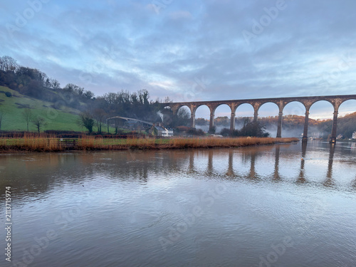 Calstock, Cornwall, England, UK – July 1, 2026: The historic Calstock Viaduct spanning the River Tamar in Cornwall on a summer morning overcast day
