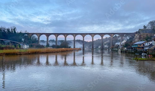 Calstock, Cornwall, England, UK – July 1, 2026: The historic Calstock Viaduct spanning the River Tamar in Cornwall on a summer morning overcast day