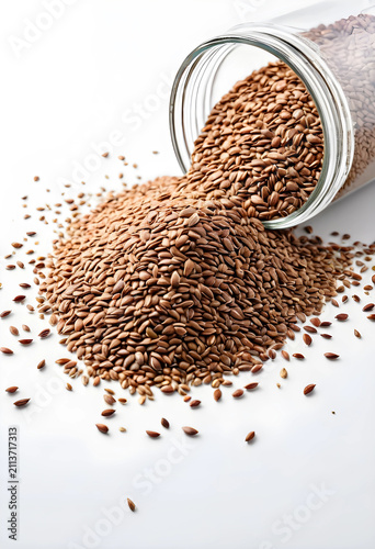 Glass jar spilling flax see...