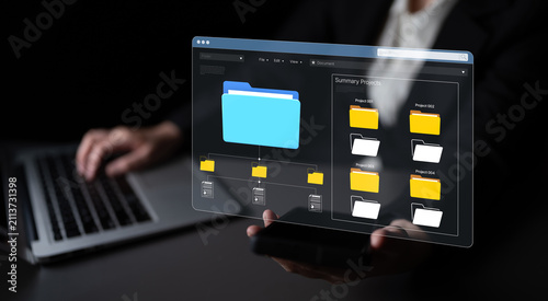 Modern Digital Workspace Showcasing Abstract Graphic of File Management System with User Interacting with Technology on Dark Background. Bitwise.