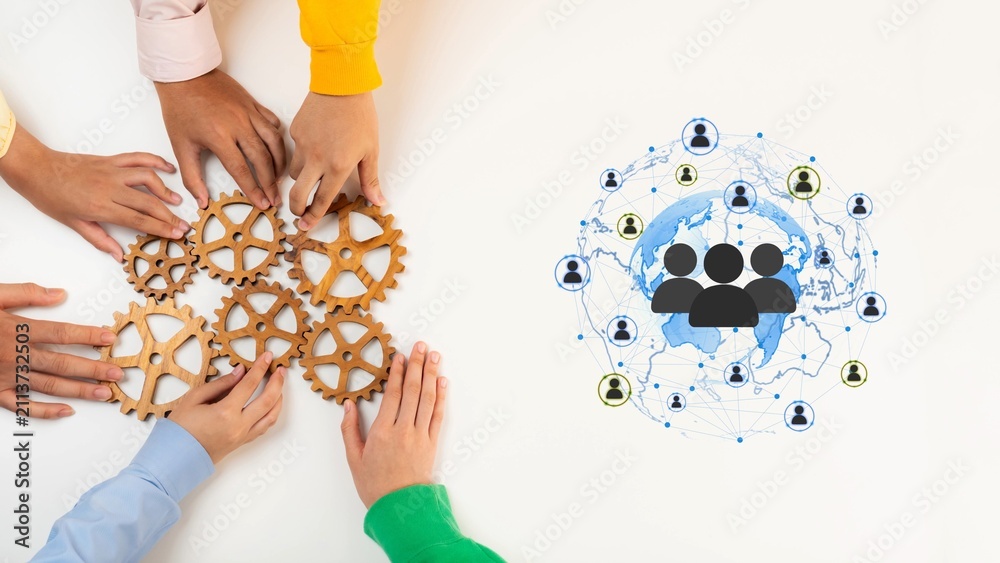 Obraz premium Diverse Hands Collaborating with Gears Symbolizing Teamwork and Global Connectivity in a Modern Office Environment. Entropy.