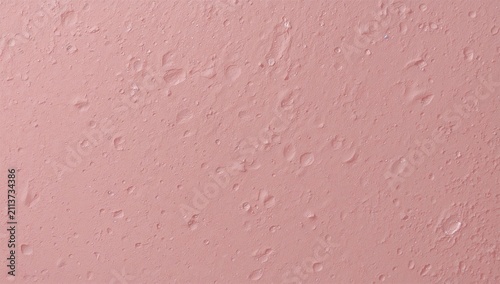 Surface of a Textured Pink Wall With Small Bubbles and Uneven Areas