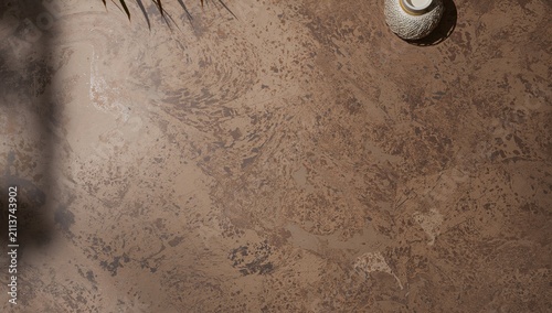 Warm Brown Textured Surface With a Candle and Plants in Natural Light