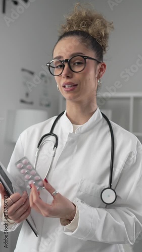 Professional female doctor discussing medication with patient pov