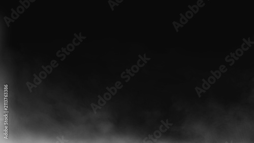 Wispy white smoke clouds against solid black