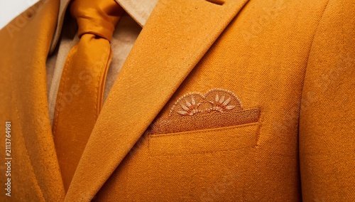 Suit Details and Accessories on Display During a Fashion Event in a Modern Ve...
