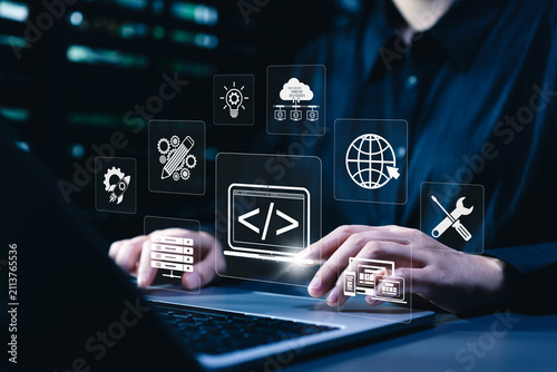 Web development and web design concept. Programmer using laptop and coding interface, showing responsive layout, website creation, cloud hosting, server management, digital tools, software workflow
