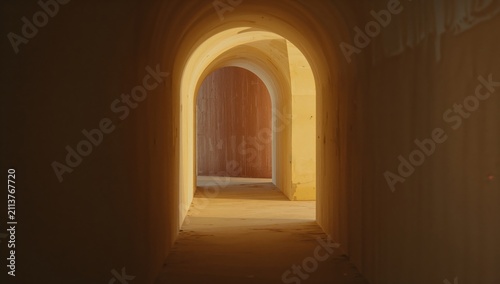 Light Shines Through Arches in a Hallway Indoors