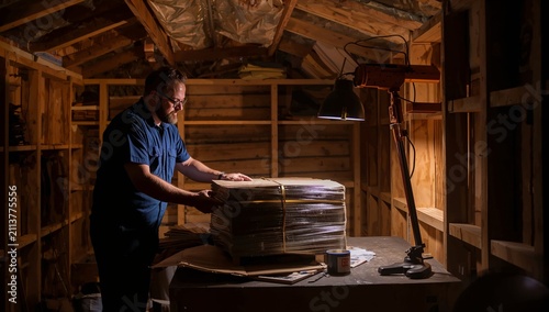 Warehouse Worker Checks Inventory in a Large Storage Facility