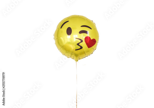 Fotografie Gold foil balloon emoji with winking eye and blowing heart kiss isolated on tran