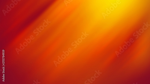 Abstract orange and yellow gradient background with soft light rays and motion blur.
