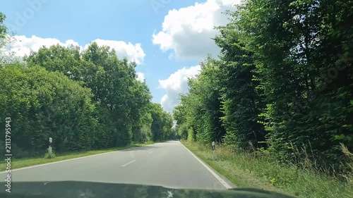 Car point of view driving on a scenic German country road