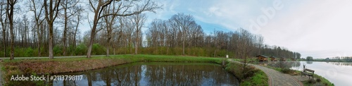 Panoramic view of a calm lake on a sunny summer day