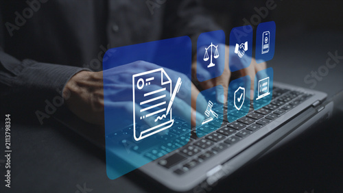 Terms of service and legal agreements concept. Person using laptop with legal document and compliance icons, contract management, policy acceptance and digital business governance.