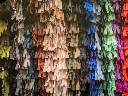 Closeup of colourful zippers for sale