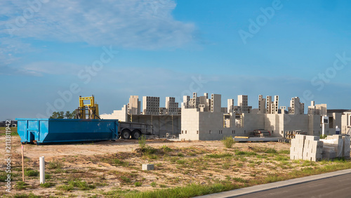 Konstfotografi Construction site of a large upscale house, with concrete shells in progress and