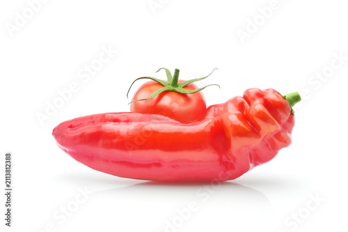 Organic fresh paprika or sweet kapia pepper and juicy tomato, isolated red vegetables on white background