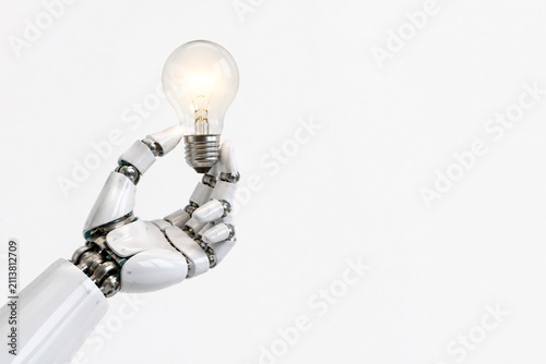 A light bulb in hands; a robot hand holding a light bulb