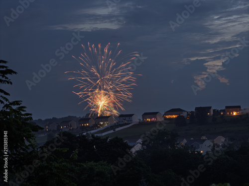 4th of July fireworks launch above a hillside suburban community in Pennsylvania USA