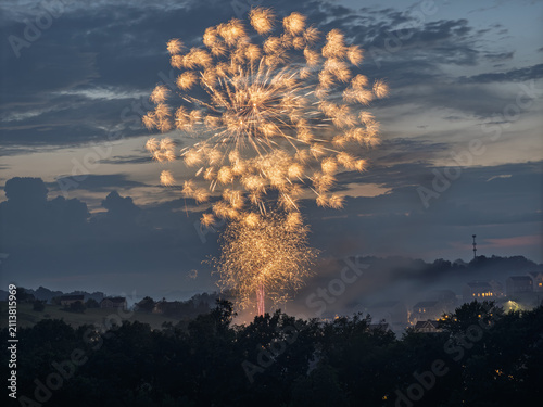 4th of July fireworks burst over a residential suburban neighborhood in Pennsylvania USA