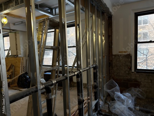 Metal Wall Framing and Plumbing Installation Inside Building Under Renovation